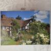 Puzzle 500 pièces d'une maison avec jardin de fleurs jou.c11